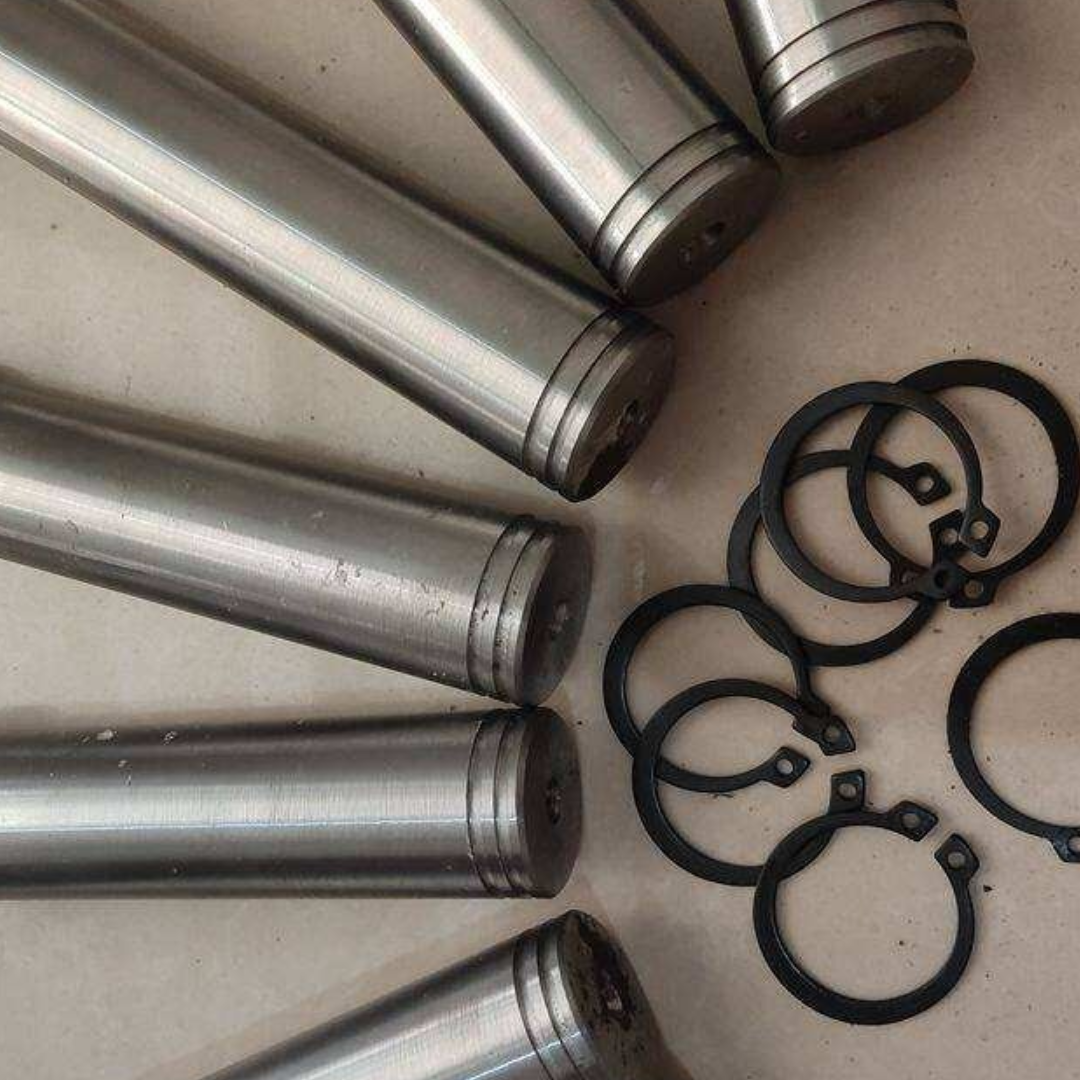 Hydraulic cylinder clevis pin retaining groove